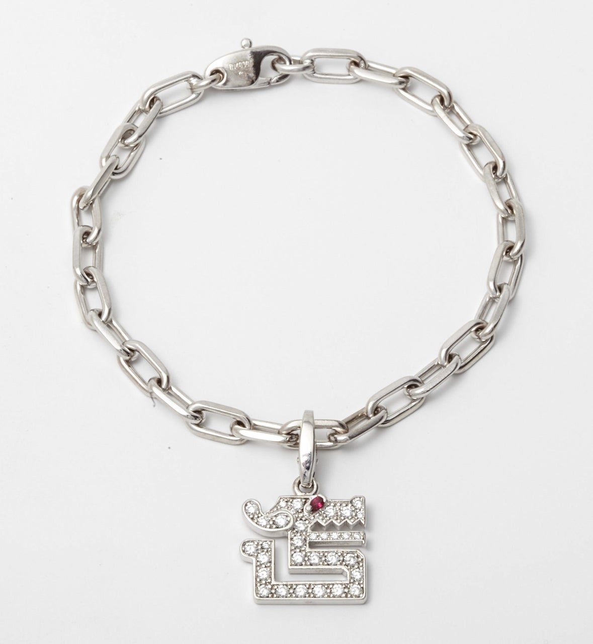 A golden, diamond and ruby bracelet by Cartier