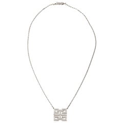 A golden and diamond necklace by Cartier