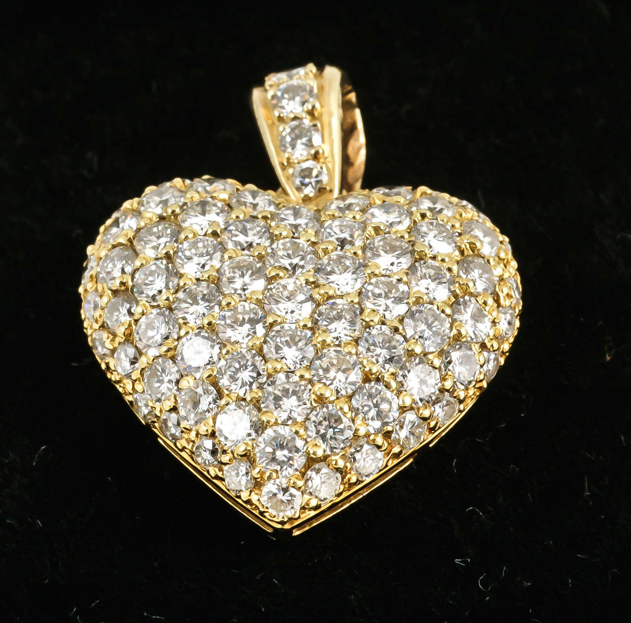 Very good quality pave diamond set Heart pendant.