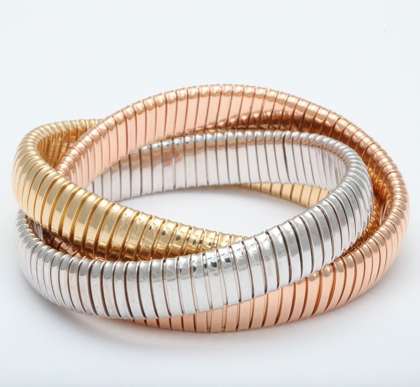 3 band rolling bracelet each band 12mm wide,  18k rose gold, yellow gold and white gold.  Available in all one color or mixed colors of your choice. 5 week delivery
