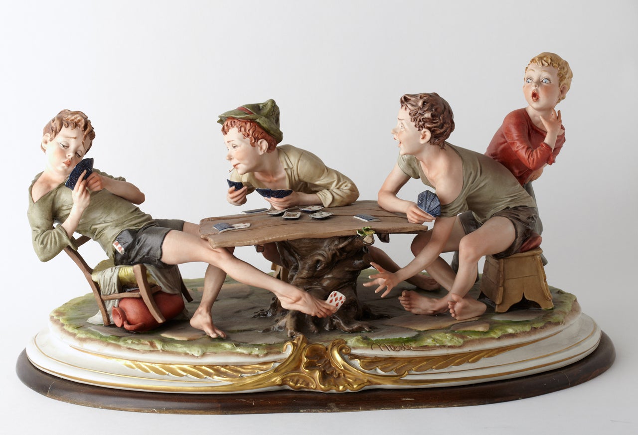 Extraordinary porcelaine group signed Capodimonte representing joung boys citing at playing cards