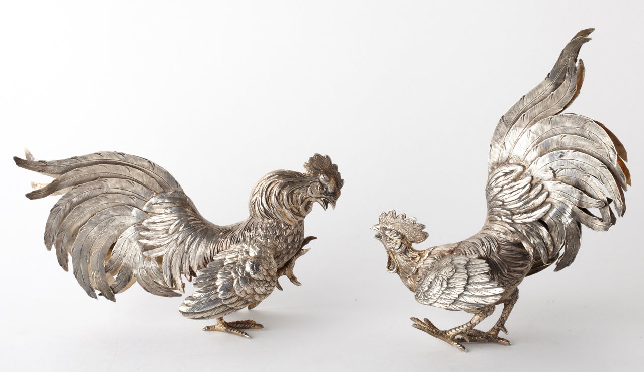 From the late 19th century up to the modern times,models of animals and birds have been very popular as table decorations.These are good quality fighting roosters made in Germany in late 1800 Silver 800/1000
mesurements: h. 9 inch long 7 inch /h
