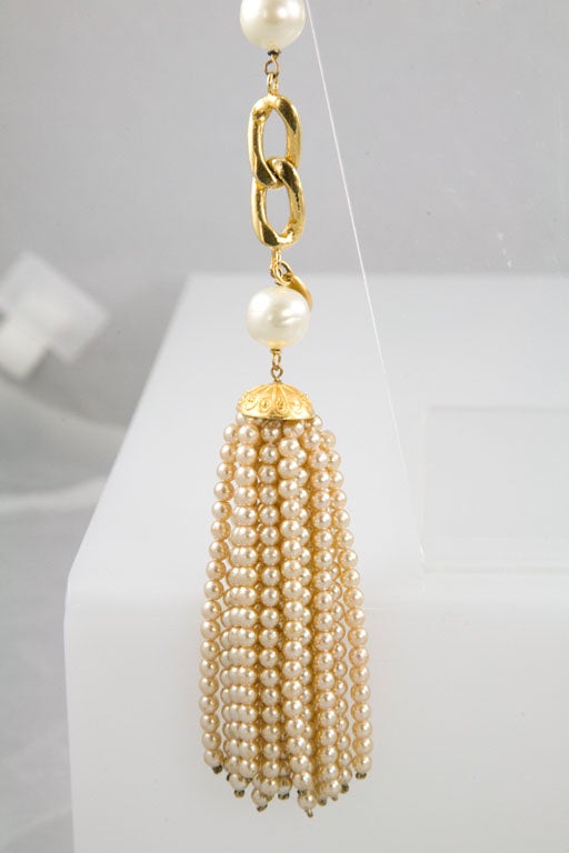 Beautiful and amazing gold plated multi-strand chain link belt/ necklace, accented with glass pearls and finished with a beautiful threaded glass pearl tassel.  Marked and stamped Chanel made in France.