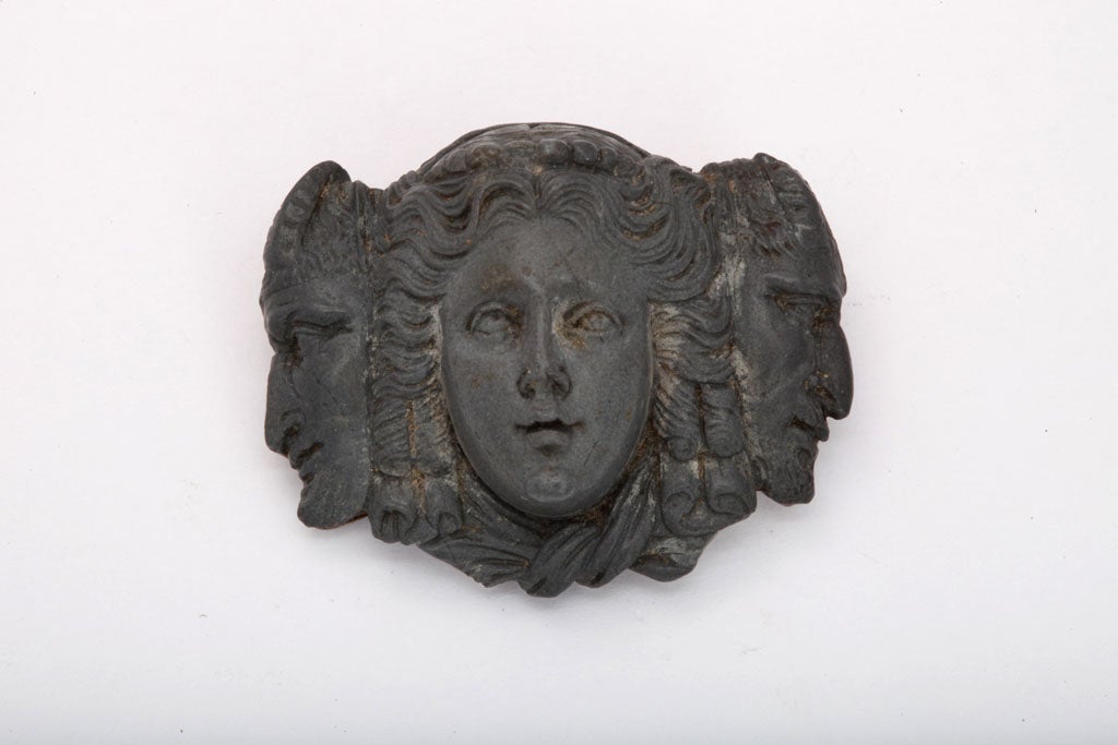 Fantastic details have been delicately carved in blue grey lava from the curls of the hair to the cleft in the chin. The lava came from an eruption of Mt. Vesuvius in the late 1870's. Note the quality of the cameo. The woman's mouth is a rosebud and