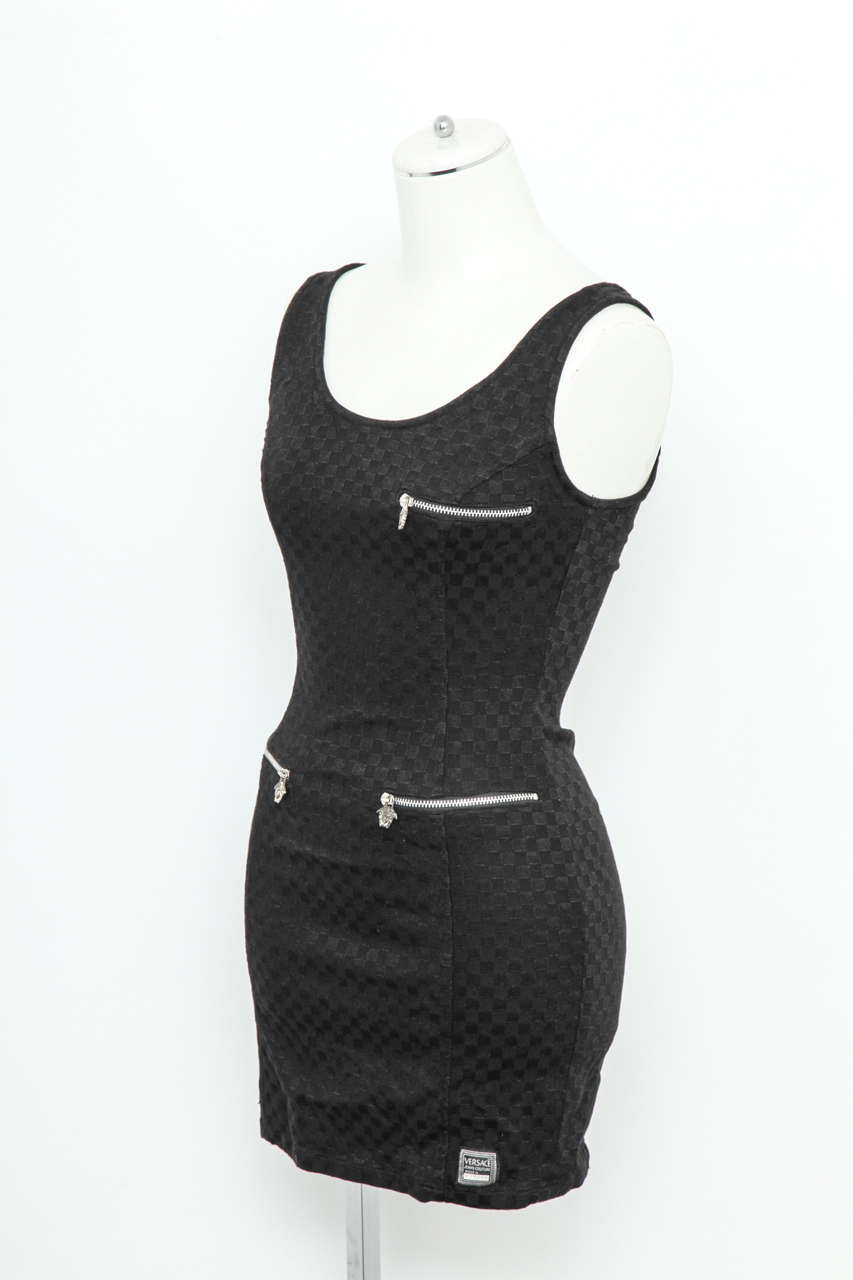 Versace Jeans Couture black dress with silver zippers and iconic medusa motif pulls.
Size XS