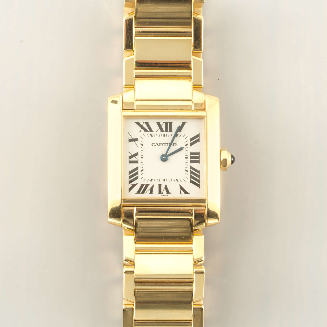 Cartier Lady's 18k Yellow Gold Tank Francaise Wristwatch, White Dial with Roman Numerals, Quartz Movement, Sapphire Cabochon Crown