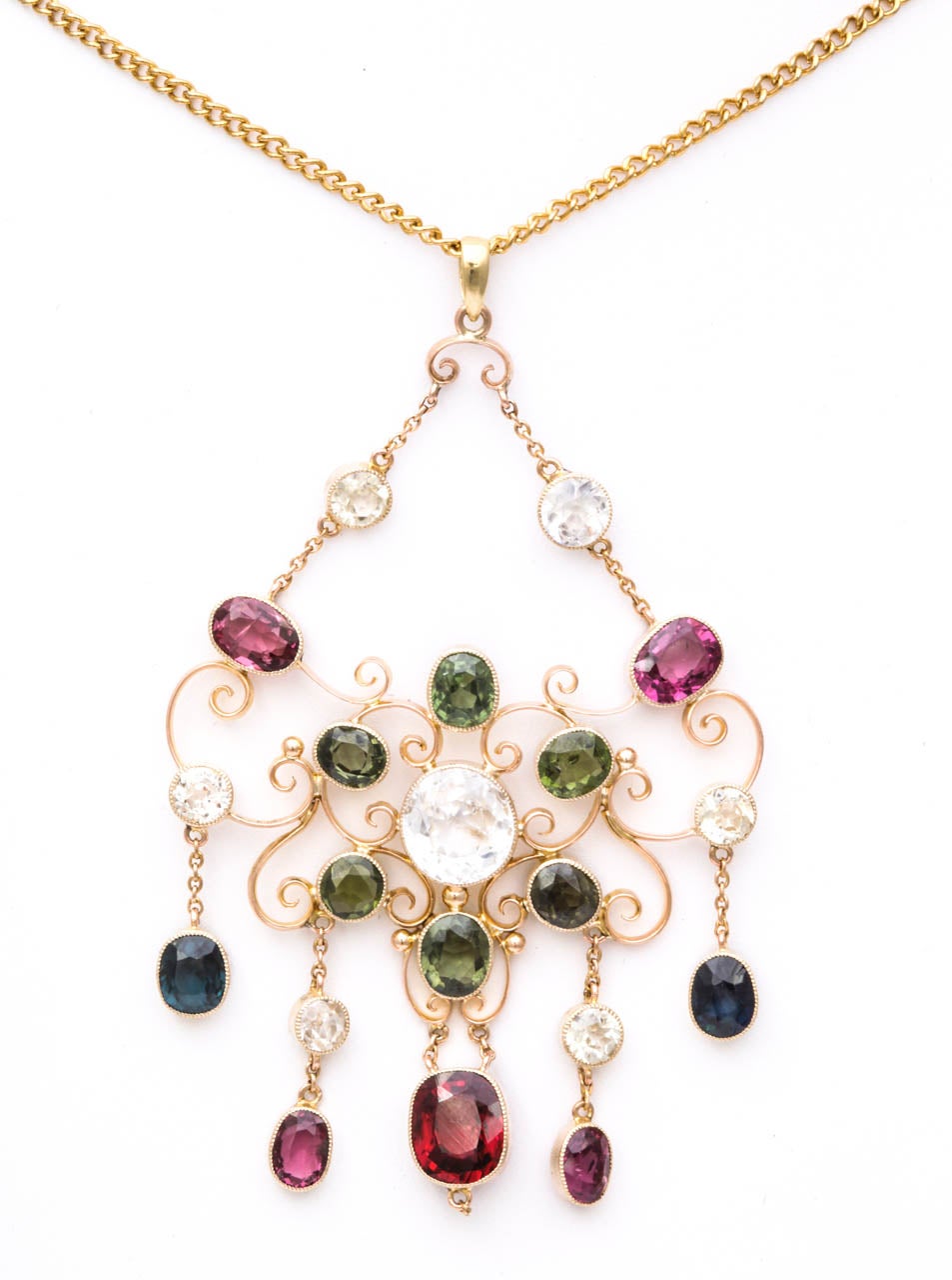 Warm color radiates from this graceful necklace, of English origin, The stones, set in 15kt gold are radiant garnets, white sapphires and natural smoky green zirconia. The beauty on the neck inspires admiration. Though Victorian c. 1880, the design