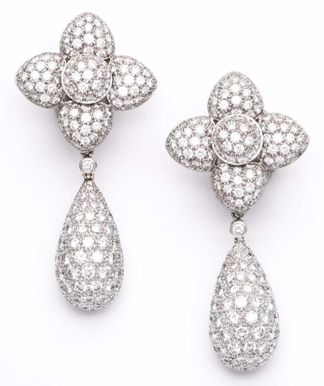 White Gold Diamond Flower Dangle Day Night Earrings. 
Total weight of diamonds - 16ct approx. 
Length - 2 1/8