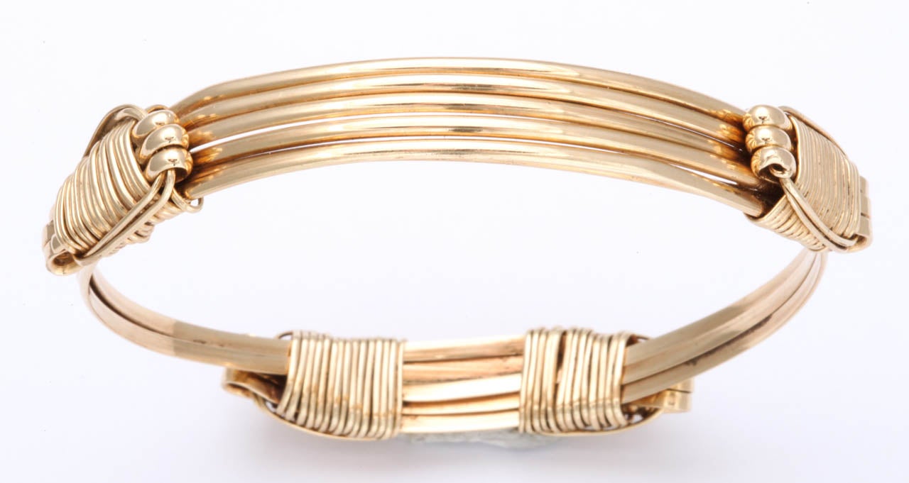 For your next Safari! An old twist, so to speak,  on the proverbial Elephant's Hair Bracelet which is usually Elephant's Hair & metal but this one is made completely by hand out of 14kt Rose Gold.  This bracelet expands to accommodate an easy fit. 