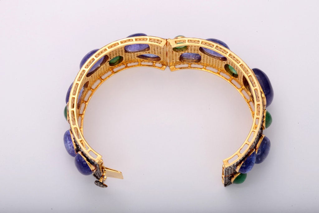 Contemporary Bold Pave Diamond Bangle with Cabochon Tanzanites and Emeralds For Sale