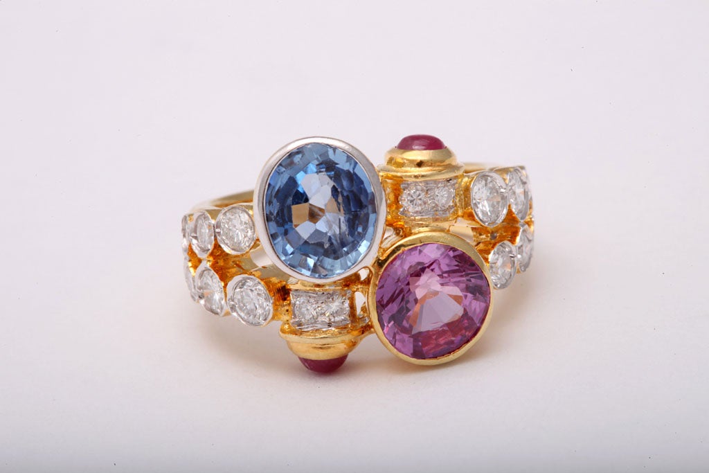 Women's Pink and Blue Sapphire Gold Crossover Ring with Diamonds and Ruby Accents