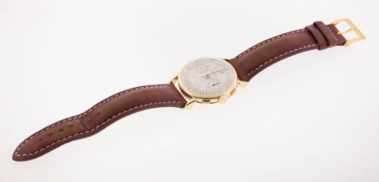 Patek Philippe 18k yellow gold oversized chronograph wristwatch with unusual lugs, Ref. 1579, circa 1940s, square buttons, with registers, tachometer, and an 18K yellow gold Patek Philippe buckle. Production of this reference began in 1943.

The