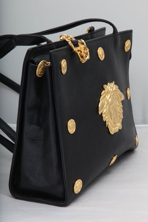 Extremely rare Gianni Versace Couture shoulder bag with iconic Medusa motifs.
Shoulder drop 18 inches