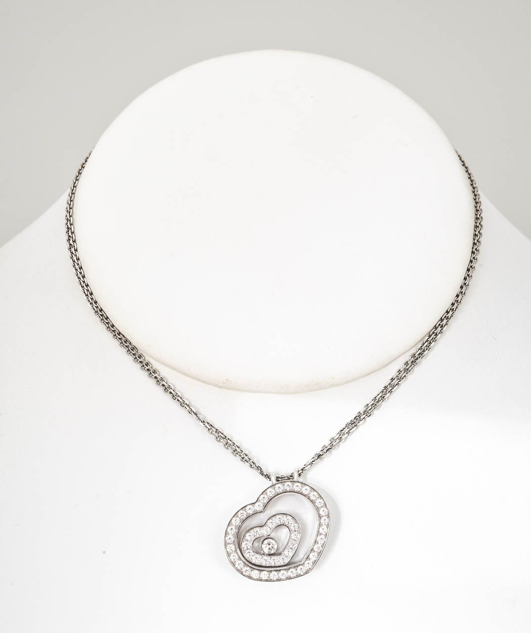 Wonderful classic Chopard piece with signature on necklace and pendant.

Retail was approximately $9,500.  It is no longer available on the Chopard web site.

47 Diamonds = 0.47ct
1 Floating Diamond = 0.10ct
18kt Double Strand Oval Link Chain,