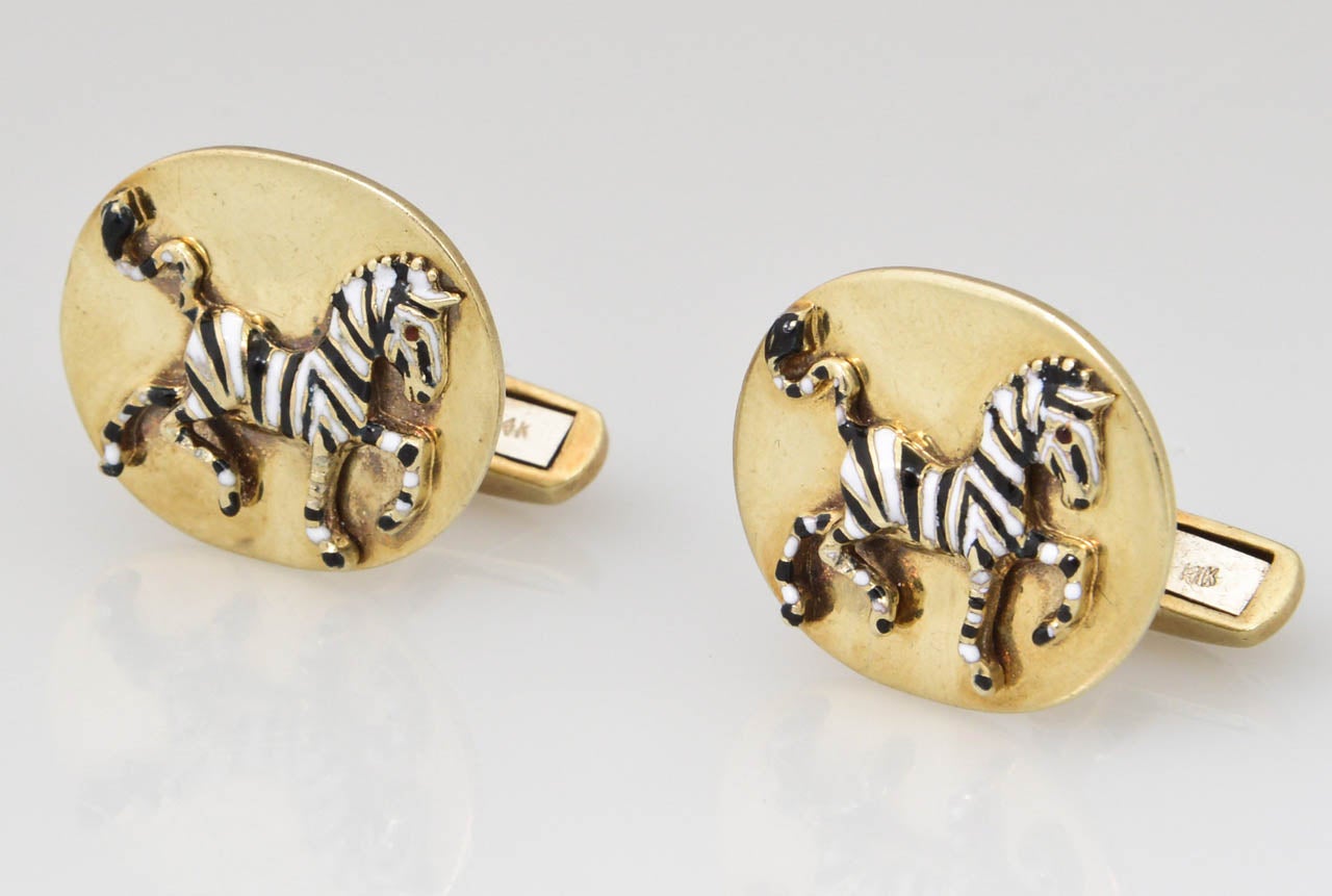 These cufflinks are a rare find.  The enamel zebras are prancing and the bars in back are beautiful pieces of art.


Laykin et Cie was founded in 1932 by Solomon W. Laykin, Irving Laykin and Allen Walker.  

