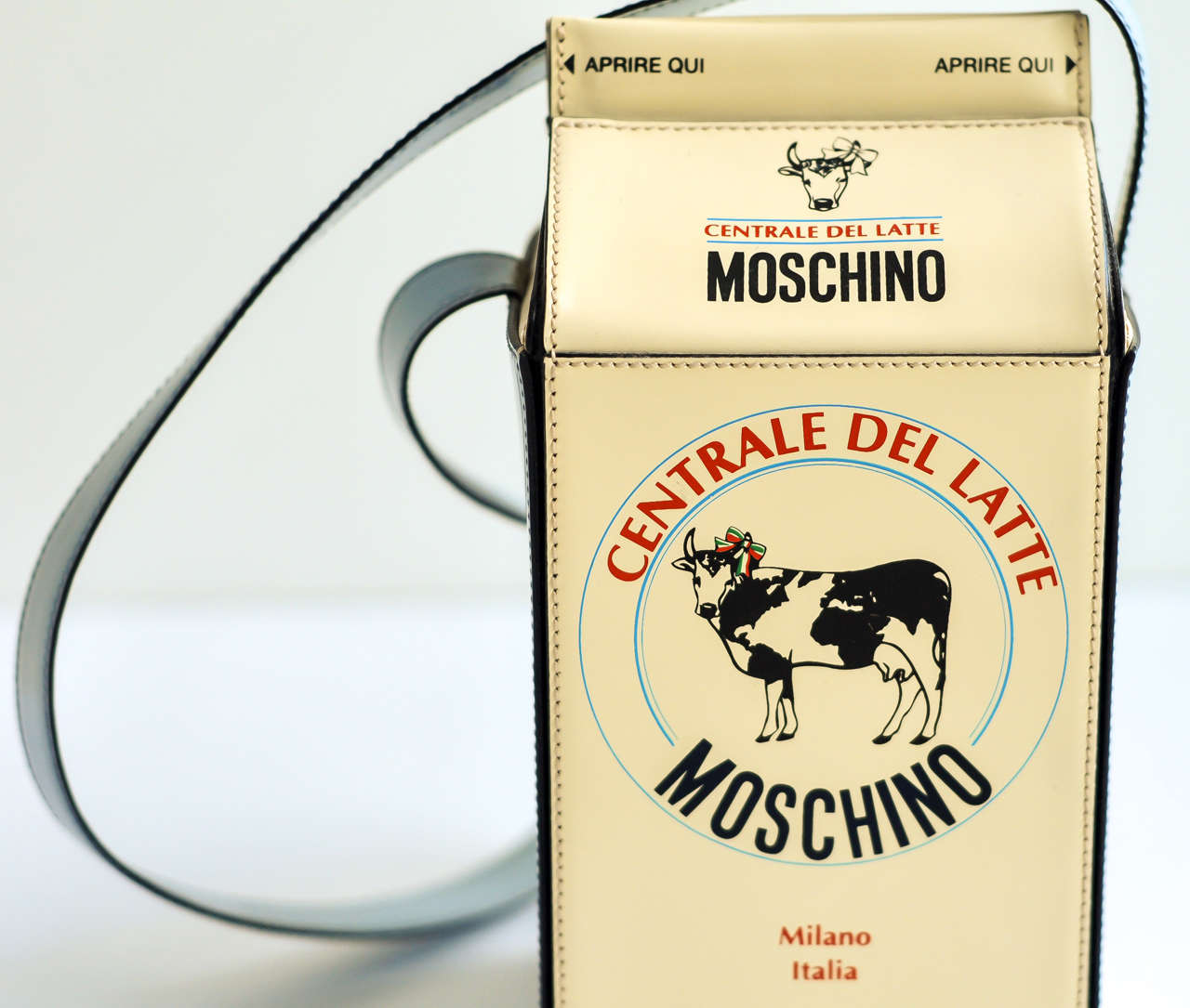 Another highly collectible, vintage handbag by Moschino in the shape of a milk carton. The bag combines a clever design with witty, thought-provoking text.
Includes original protective cloth bag.