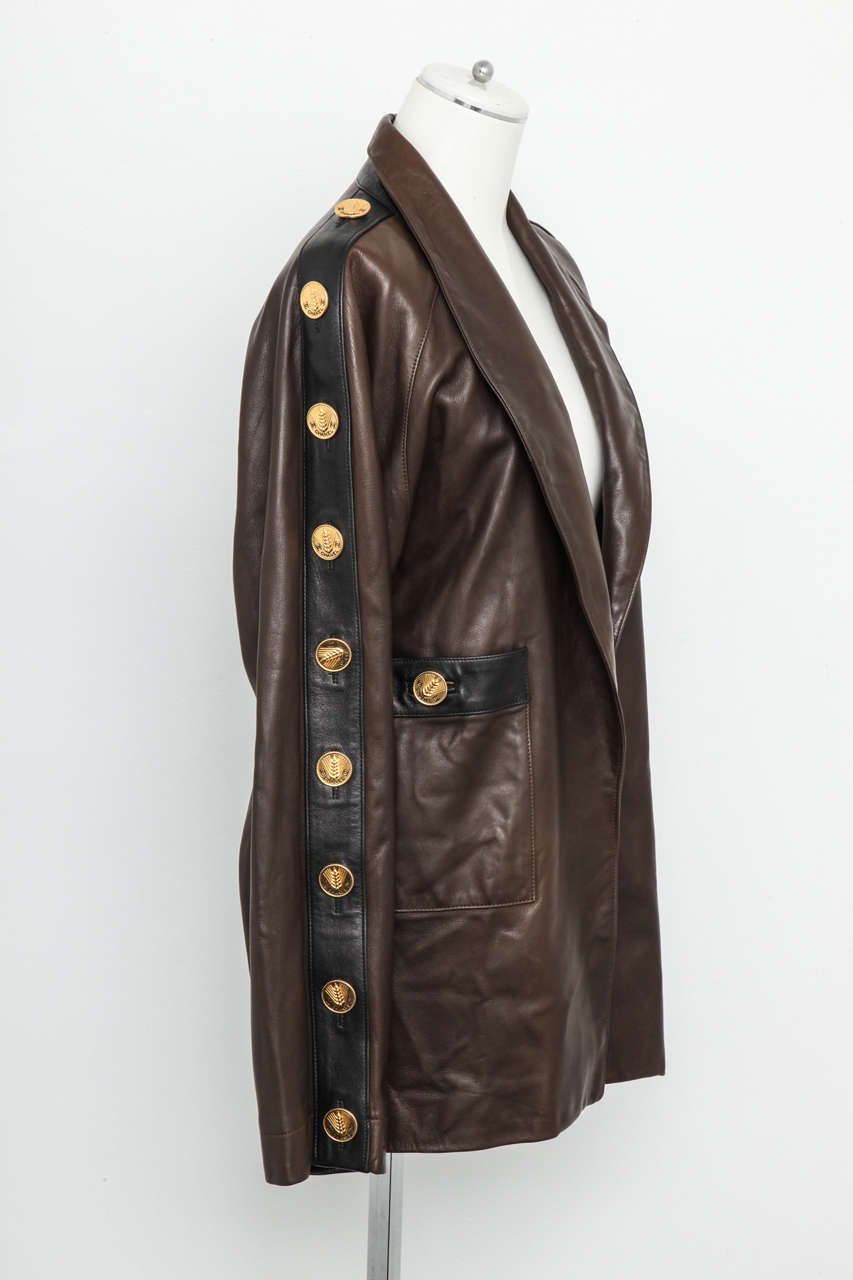 Very rare Chanel brown leather jacket with black pipings and iconic CC buttons.
Fits like French size 36.