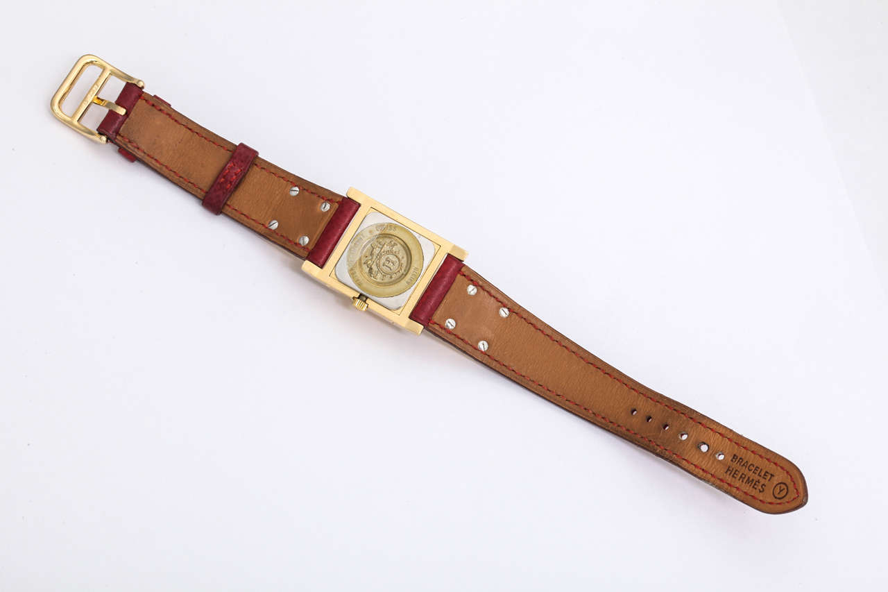 Very rare Hermes Medor watch with Gold hardware and a red belt.