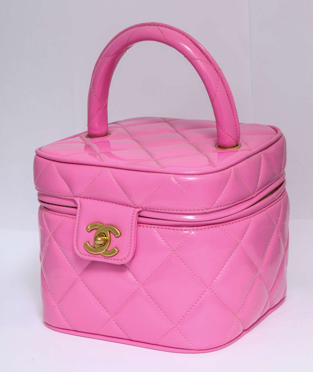 Very rare pink Chanel quilted vanity case bag with a heart shaped mirror and large CC logos.