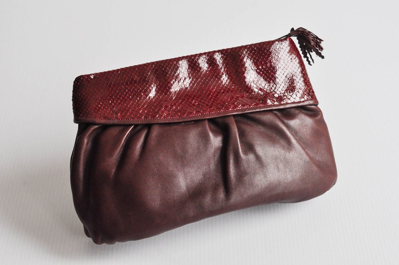 Luxurious glove leather and snakeskin clutch purse with fine detail from the 1980s by designer Walter Katten. Interesting leather pull. Made in Italy.