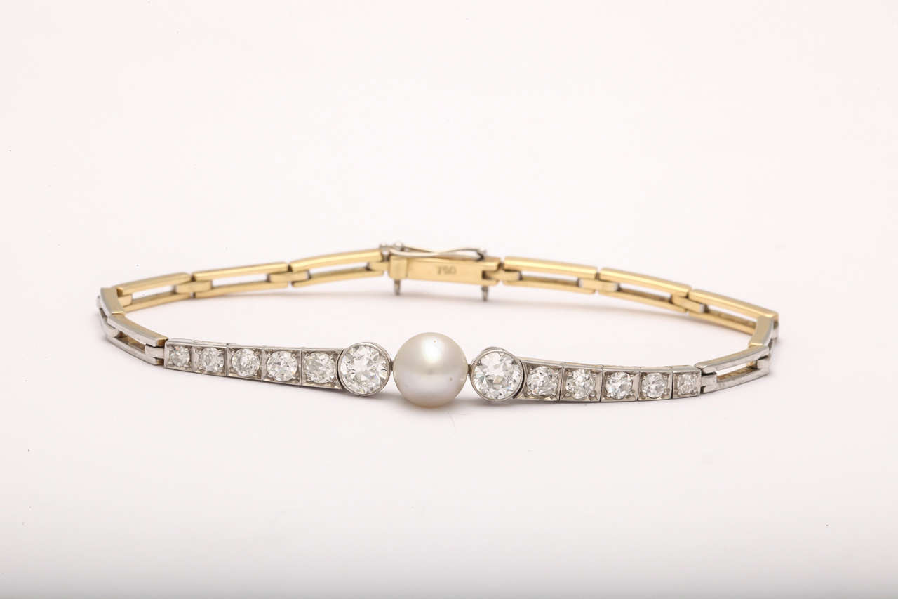 Antique  expandable Yellow Gold & Platinum Bracelet with center Natural Pearl - flanked on either side by 6 Old cut Mine Diamonds.  Very clean & very white. Top is Platinum & underside is 18kt Yellow Gold.  Old guard