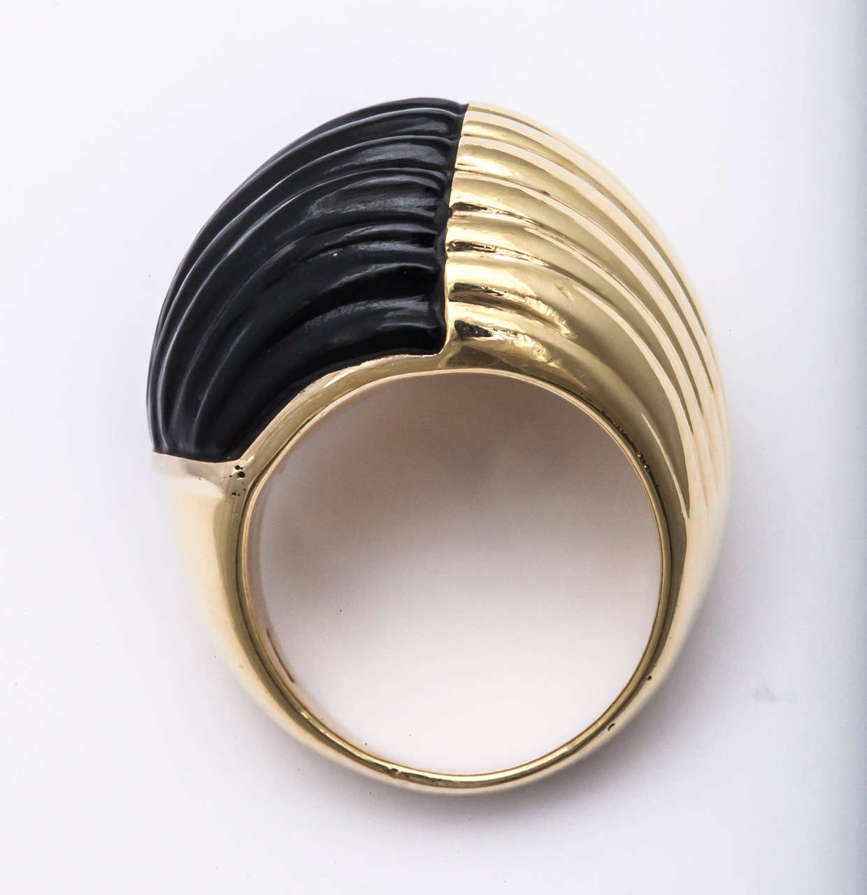 This is that one big bold Ring to wear as a signature piece.  Half Black ribbed & half Striated Yellow Gold. Noticeable and impressive. Size 7 - but can be sized.