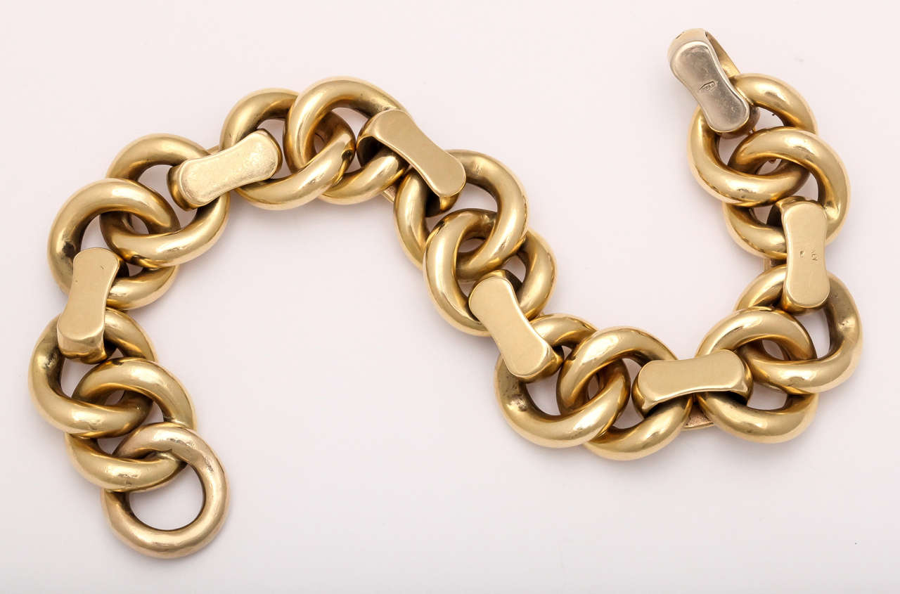 18kt Yellow Gold..Interesting & rich variation of a cable Link Bracelet.  Italian - ca 1960.  Heavy but not overpowering.  Self closing clasp with a soft semi-polished finish.