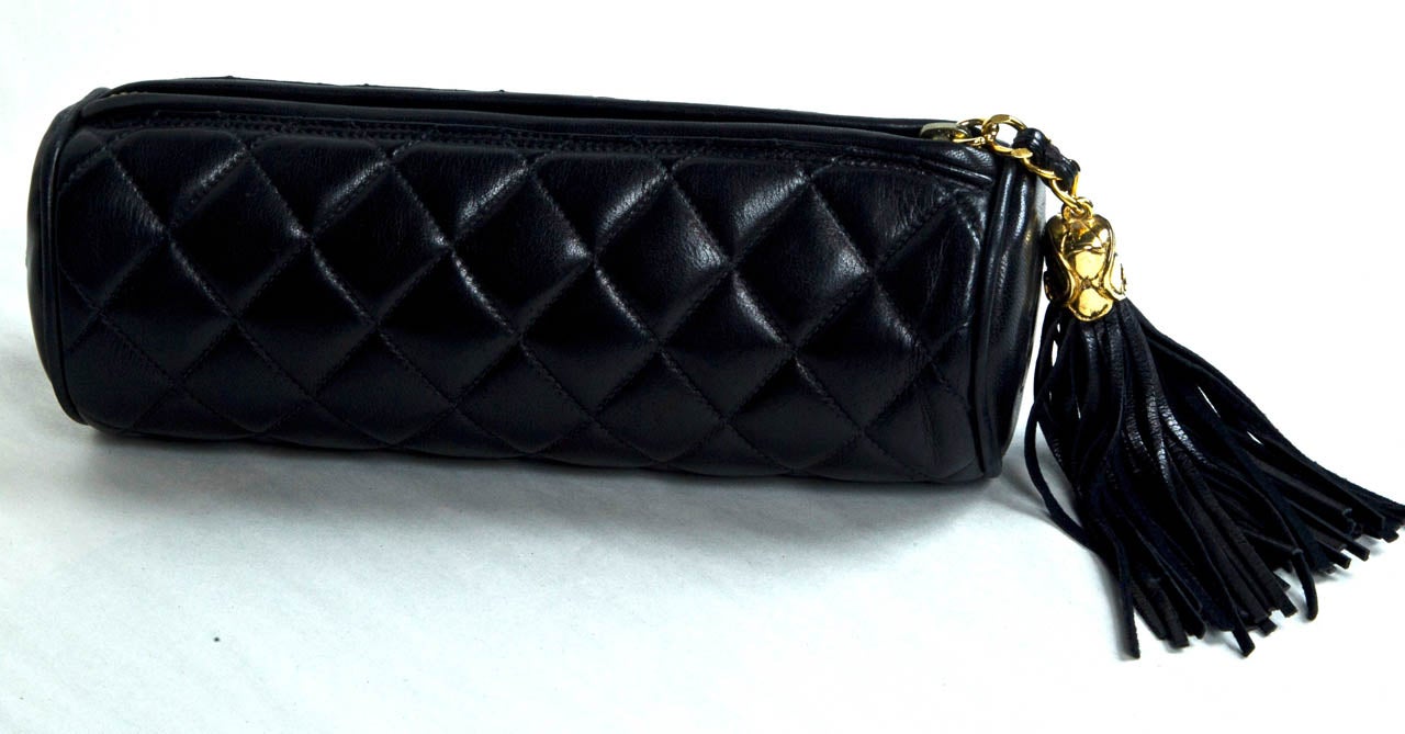 from the funkyfinders founder's closet is this chanel cylinder clutch. her signature black quilted lambskin surround coupled with an opulent logo tassel make this find an epitome treasure.