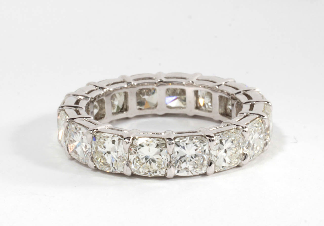 Beautiful handmade cushion cut diamond eternity band. 

6.93 carats of F-G color VS clarity diamonds set in platinum. 

Each cushion cut diamond is just under half a carat.

The ring is size 6.5 but can be easily adjusted.
