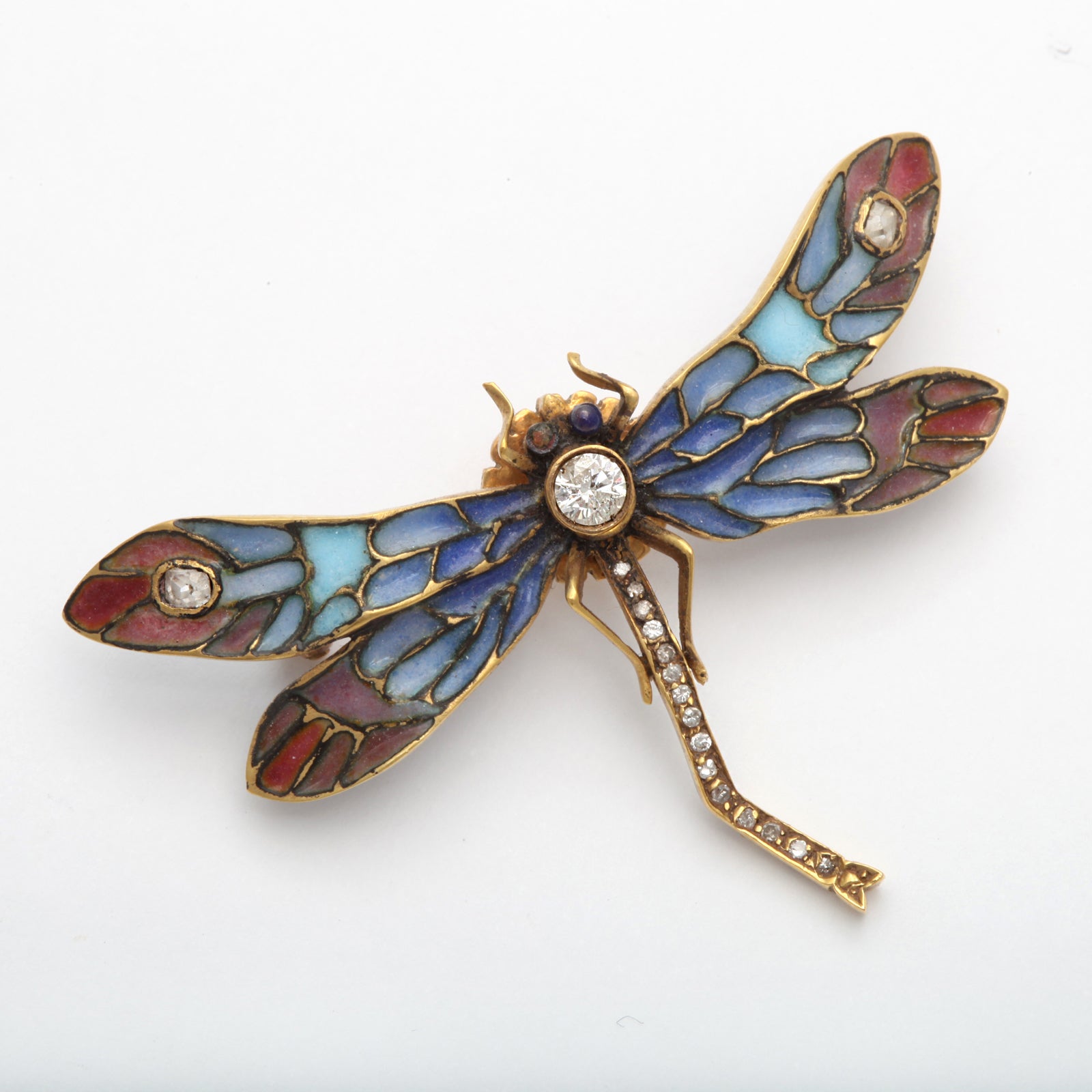 A delicate plique a jour dragonfly with diamonds set in 18 kt gold