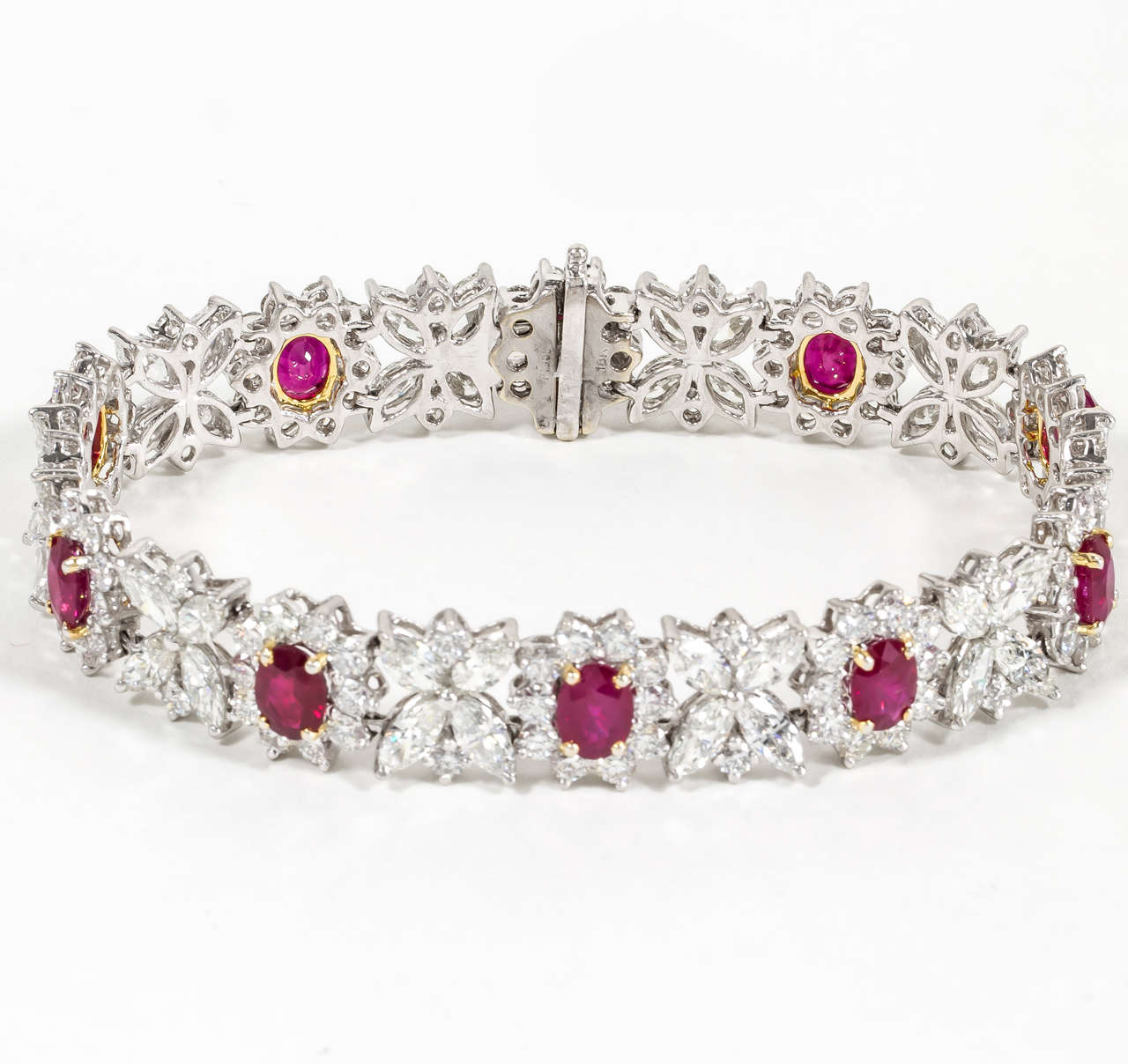 
Elegant ruby and diamond bracelet set in platinum. 

11.41 carats of oval Burma Rubys. 

Over 22 carats of beautiful white diamonds.