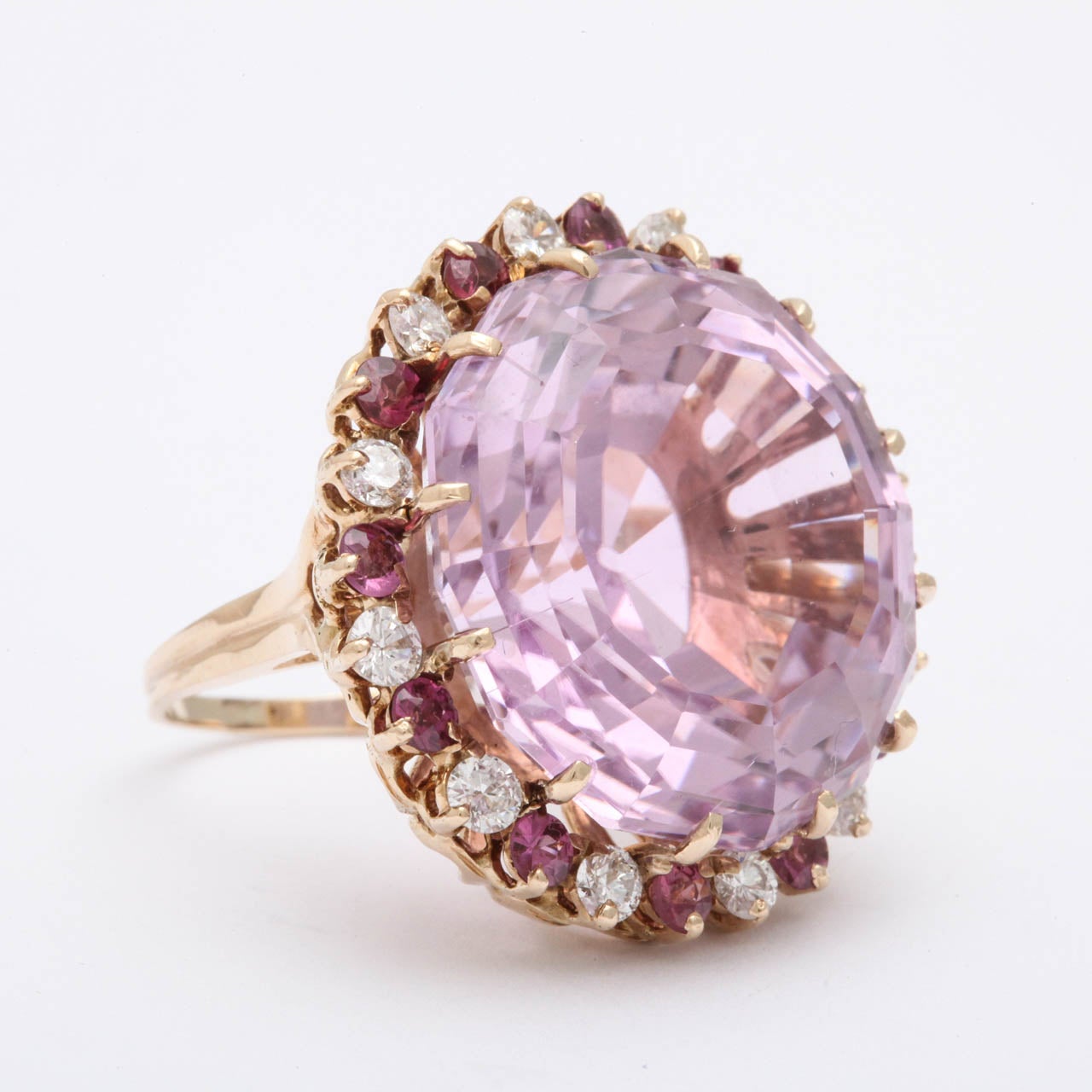 40 Carat Pink Kunzite Cocktail Ring Surrounded by Numerous Diamonds And Pink Tourmalines setting in 18kt yellow gold ring size 6 may be sized to any size you require