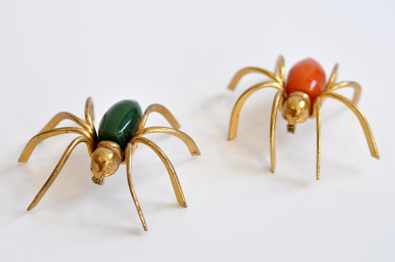 A pair of Art Deco spider pins with green and orange bodies. Can be sold individually. Very friendly and good for the environment.