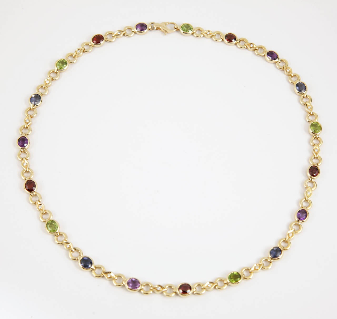 18ct gold, sapphire and coloured stone necklace

Italian

c.1980