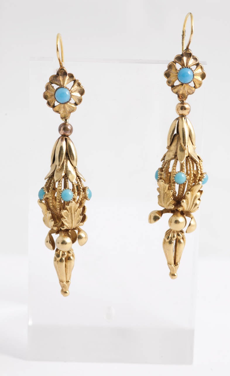 Long articulated 15ct Gold Regency earrings set with Turquoise.