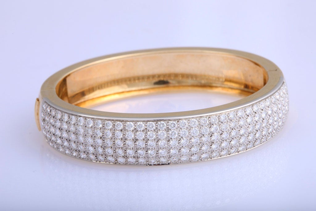 Wide heavy Bangle with Pave Diamond Top & weighing 31.1dwts.  Over 7cts Total.  Full cut clean white Diamonds