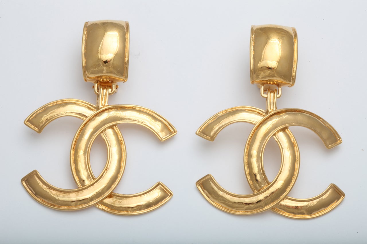 Chanel large dangling earrings with iconic CC logos.