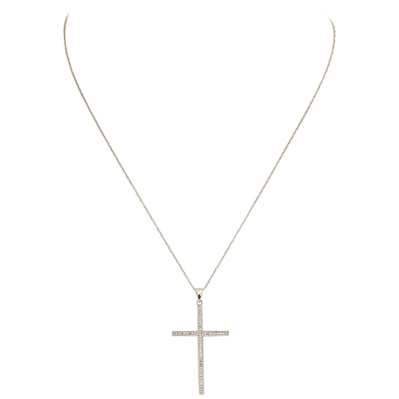 Simple and elegant cross necklace with .25 ct white diamonds. The chain is 16 in. and can be changed to another length. This beautiful cross is a welcome gift for any occasion.