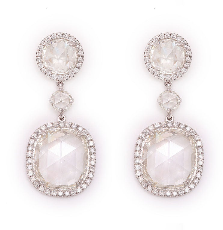 Important Cushion Cut Diamond Earrings Rose Cuts 11.10 Total carat weight<br />
Center Stones 7.50 Tw <br />
2 round stones 1.25 <br />
2.35 Micro pave diamonds