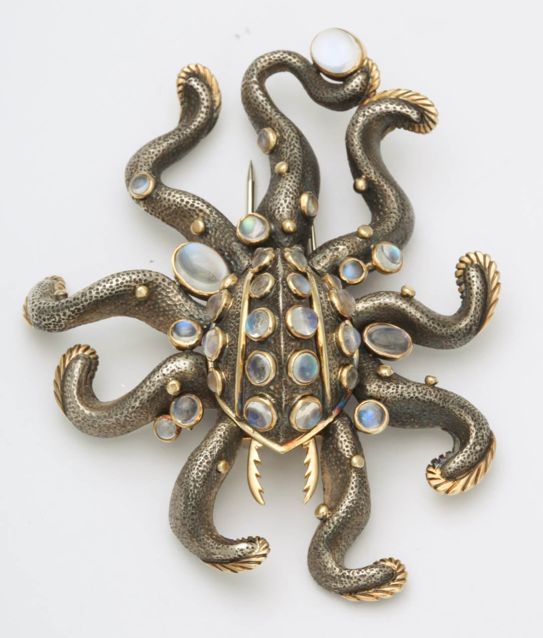 Overpowering Octopus Pin in patinated silver & 18kt Yellow Gold set with  glistening Moonstones.  Signed.   MFC 750 & 925.  Body in silver & details edged in 18Kt  yellow Gold and fastened by double clip for security.