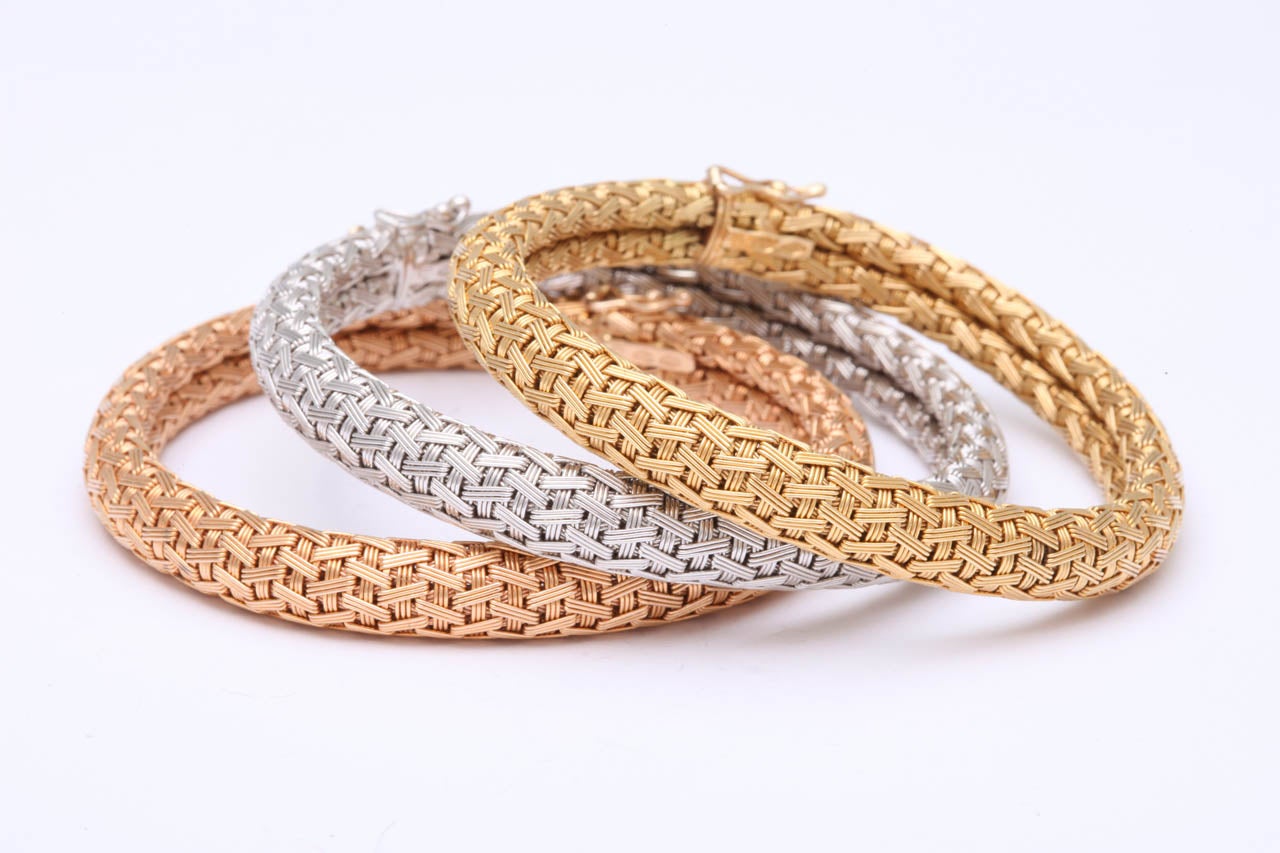 Wear them any way you want - Three identical Bracelets - one in 18kt Yellow Gold - one in 18kt White Gold & one in 18kt Rose Gold.  A very novel idea.  Each    one marked with 3 marks - 750, Italian assayers mark & un-identified maker's mark.  Ca