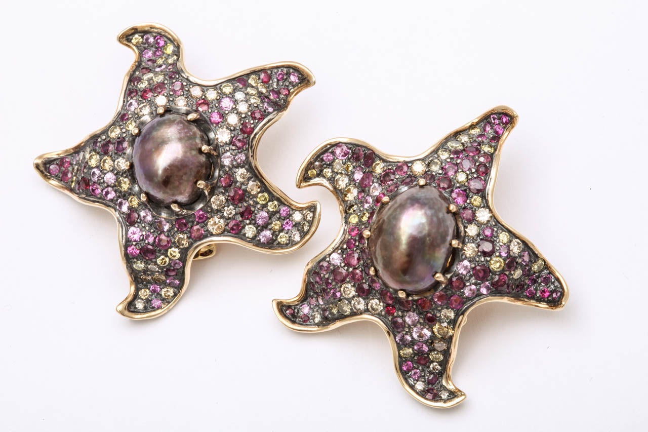 Free form Star Fish set with full cut Diamonds - Pink sapphires & Grey prong set Cultured Pearls. 18kt & Sterling.  Set with 15.50 Pink Sapphires & 3.97cts of Diamonds. Signed MFC for Marilyn Fein Cooperman and dated 2011