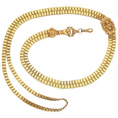 A Fine Long Gold Hand Chain with Slide