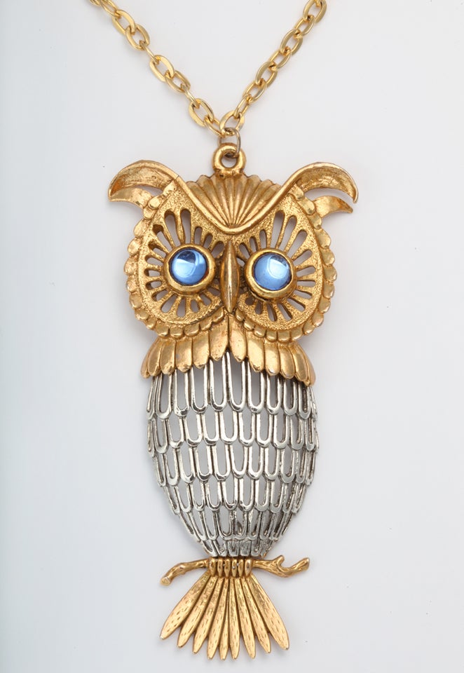 Blue eyed, two tone, articulated owl with pierced feathers.