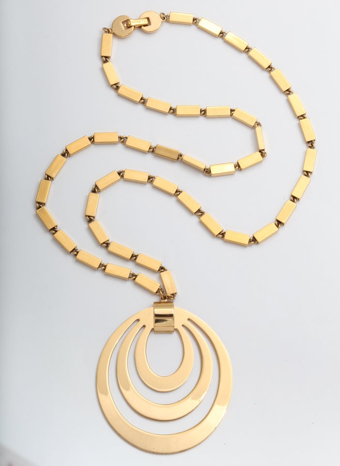 Mod pendant necklace with concentric ovals. Chain is 26