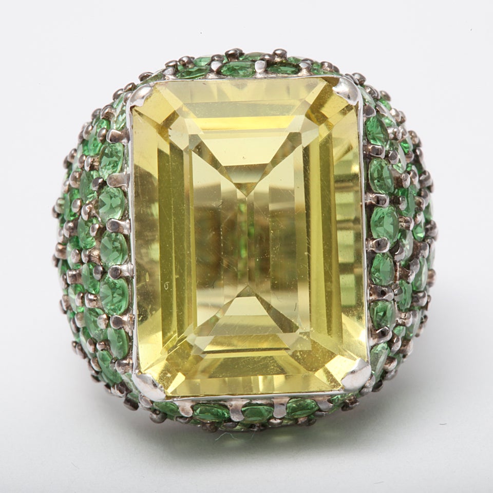 14kt Whte Gold high mounting with several rows of graded Tsavorite stones, prong set, contrasting with a flawless, crisp - Lemon Citrine.