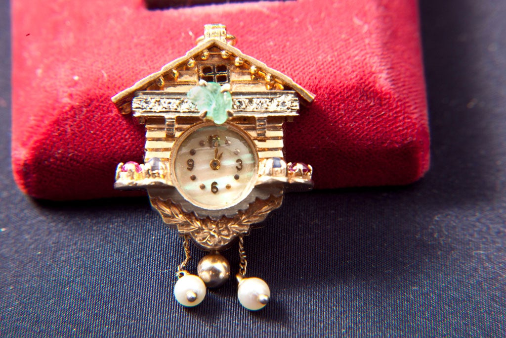 14 KT. GOLD WORKING CUCKOO CLOCK PENDENT/ CHARM  CLOCK WITH DIAMONDS, EMERALDS, SAPPHIRES AND RUBIES-  (17.20 DWT WITH WATCH_)