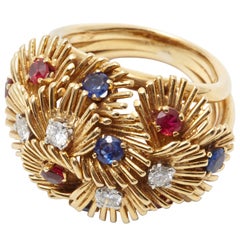A Sapphire Ruby Diamond Gold Capucines Ring by Van Cleef 
Arpels