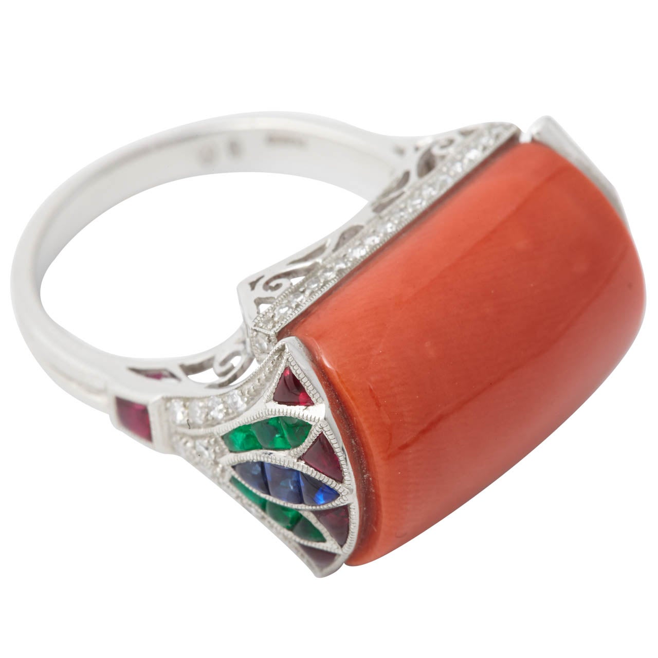 A Coral, Calibré Cut Ruby, Emerald, Sapphire and Diamond Platinum Dress Ring. For Sale
