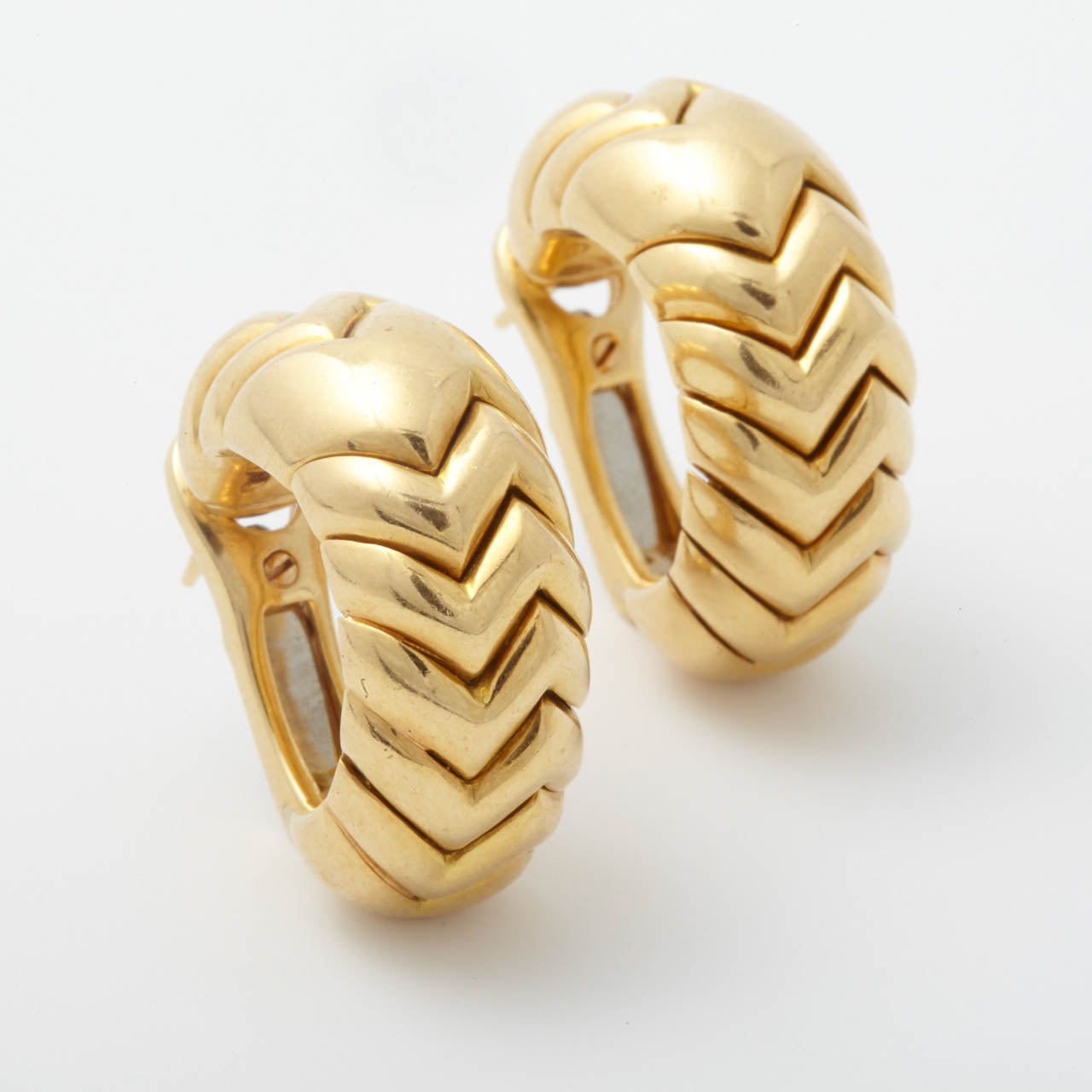 A pair of 18k yellow gold â??Spigaâ?? hoop earrings. Engraved Bulgari.

All of our prices exclude VAT.
